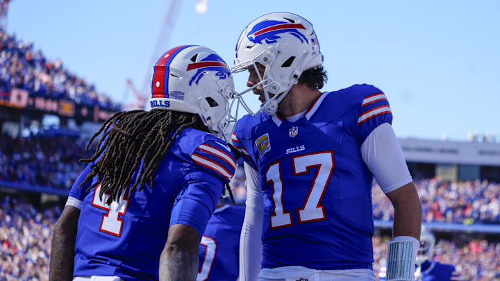 Oct 20, 2024; Orchard Park, New York, USA; Buffalo Bills quarterback Josh Allen (17) congratulates Buffalo Bills running back James Cook (4) for scoring a touchdown against the Tennessee Titans during the first half