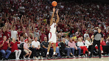 Oct 25, 2024; Fayetteville, AR, USA; Arkansas Razorbacks guard D.J. Wagner (21) shoots a three-point shot in the second half against the Kansas Jayhawks at Bud Walton Arena. Mandatory Credit: Nelson Chenault-Imagn Images