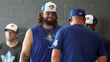 Feb 15, 2025; Dunedin, FL, USA;Toronto Blue Jays pitcher Alek Manoah (6) talks with manager John Schneider (14)  during spring training workouts at TD Ballpark. Mandatory Credit: Kim Klement Neitzel-Imagn Images