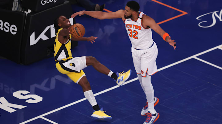 May 21, 2025; New York, New York, USA; New York Knicks center Karl-Anthony Towns (32) defends against Indiana Pacers forward Aaron Nesmith (23) in the first quarter during game one of the eastern conference finals for the 2025 NBA Playoffs at Madison Square Garden. Mandatory Credit: Brad Penner-Imagn Images
