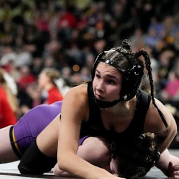 Raccoon River-Northwest’s Katie Biscoglia wrestles Indianola’s Nora Ohnemus in a Class 2A 105-pound semifinal match at the IGHSAU state wrestling tournament Day 2 Friday, Feb. 7, 2025 at Xtream Arena in Coralville, Iowa.