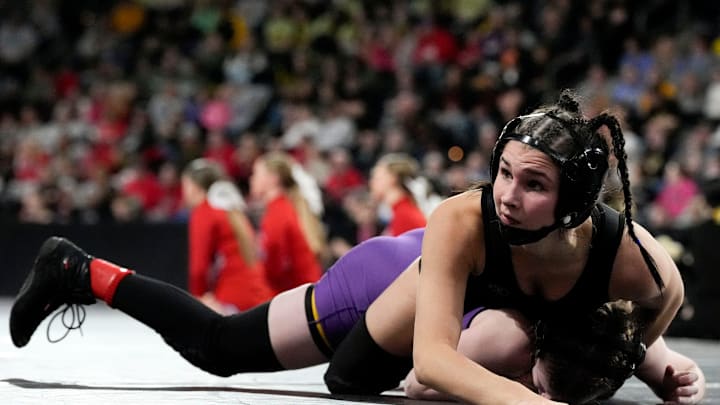 Raccoon River-Northwest’s Katie Biscoglia wrestles Indianola’s Nora Ohnemus in a Class 2A 105-pound semifinal match at the IGHSAU state wrestling tournament Day 2 Friday, Feb. 7, 2025 at Xtream Arena in Coralville, Iowa.