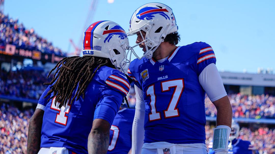 Buffalo Bills quarterback Josh Allen (17) and running back James Cook (4.