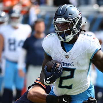 Sep 8, 2024; Chicago, Illinois, USA; Tennessee Titans running back Tyjae Spears (2) makes a catch against the Chicago Bears during the first quarter at Soldier Field. Mandatory Credit: Mike Dinovo-Imagn Images