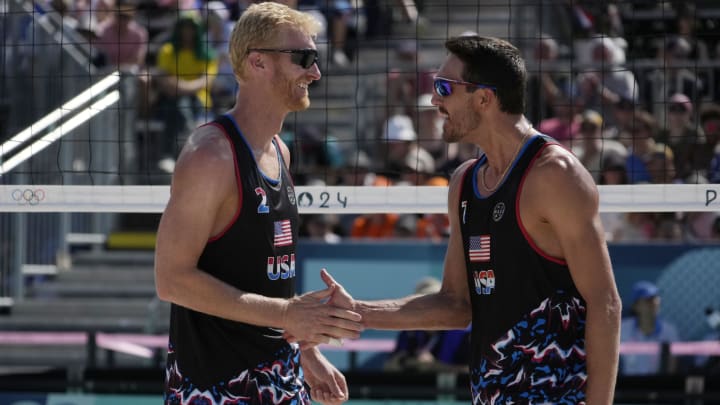 Jul 29, 2024; Paris, France; Miles Evans (USA) and Chase Budinger (USA) celebrate defeating France in a beach volleyball preliminary phase match during the Paris 2024 Olympic Summer Games at Eiffel Tower Stadium. Mandatory Credit: Michael Madrid-USA TODAY Sports Jul 29, 2024; Paris, France; Miles Evans (USA) and Chase Budinger (USA) celebrate defeating France in a beach volleyball preliminary phase match during the Paris 2024 Olympic Summer Games at Eiffel Tower Stadium. Mandatory Credit: Michael Madrid-USA TODAY Sports