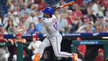 Jun 22, 2025; Philadelphia, Pennsylvania, USA; New York Mets infielder Francisco Lindor (12) hits a home run against the Philadelphia Phillies in the eighth inning at Citizens Bank Park. Mandatory Credit: Kyle Ross-Imagn Images