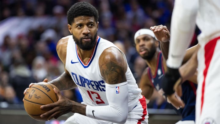Clippers forward Paul George controls the ball against the 76ers during a game in March.