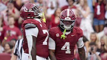 Alabama offensive lineman Kam Dewberry and running back Daniel Hill celebrates after scoring a touchdown.