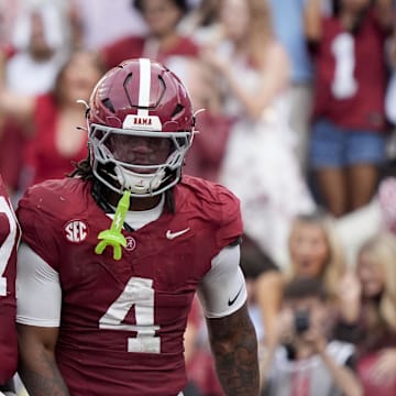 Alabama offensive lineman Kam Dewberry and running back Daniel Hill celebrates after scoring a touchdown.