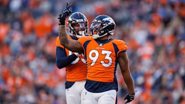 Dec 12, 2021; Denver, Colorado, USA; Denver Broncos defensive end Dre'Mont Jones (93) celebrates with linebacker Bradley Chubb (55) after a play in the third quarter against the Detroit Lions at Empower Field at Mile High. 