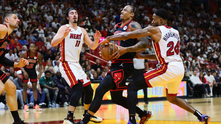 Apr 19, 2024; Miami, Florida, USA; Chicago Bulls forward DeMar DeRozan (11) drives to the basket past Miami Heat forward Haywood Highsmith (24) in the second quarter during a play-in game of the 2024 NBA playoffs at Kaseya Center. Mandatory Credit: Sam Navarro-USA TODAY Sports