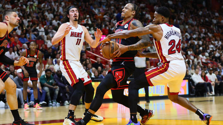 Apr 19, 2024; Miami, Florida, USA; Chicago Bulls forward DeMar DeRozan (11) drives to the basket past Miami Heat forward Haywood Highsmith (24) in the second quarter during a play-in game of the 2024 NBA playoffs at Kaseya Center. Mandatory Credit: Sam Navarro-USA TODAY Sports