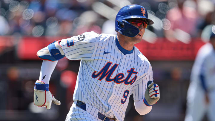 Jul 11, 2024; New York City, New York, USA; New York Mets left fielder Brandon Nimmo (9) hits a three RBI double during the fifth inning against the Washington Nationals at Citi Field. Mandatory Credit: Vincent Carchietta-USA TODAY Sports