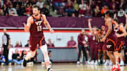 Feb 15, 2025; Blacksburg, Virginia, USA; Virginia Tech Hokies forward Ben Burnham (13) celebrates a three point basket during the second half against the Virginia Cavaliers at Cassell Coliseum. Mandatory Credit: Brian Bishop-Imagn Images