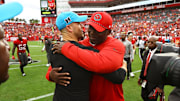 Dec 29, 2024; Tampa, Florida, USA; Tampa Bay Buccaneers head coach Todd Bowles and Carolina Panthers head coach Dave Canales greet after the game at Raymond James Stadium. Mandatory Credit: Kim Klement Neitzel-Imagn Images