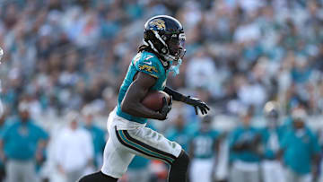 Dec 15, 2024; Jacksonville, Florida, USA; Jacksonville Jaguars wide receiver Brian Thomas Jr. (7) runs with the ball against the New York Jets in the fourth quarter at EverBank Stadium. 