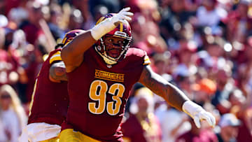 Oct 6, 2024; Landover, Maryland, USA; Washington Commanders defensive tackle Jonathan Allen (93) celebrates after a tackle during the second quarter against the Cleveland Browns at NorthWest Stadium. Mandatory Credit: Peter Casey-Imagn Images