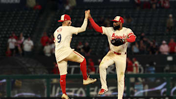Jul 29, 2025; Anaheim, California, USA;  Los Angeles Angels shortstop Zach Neto (9) and center fielder Jo Adell (7, right) celebrate a win after defeating the Texas Rangers 8-5 at Angel Stadium. Mandatory Credit: Kiyoshi Mio-Imagn Images