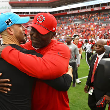 Dec 29, 2024; Tampa, Florida, USA; Tampa Bay Buccaneers head coach Todd Bowles and Carolina Panthers head coach Dave Canales greet after the game at Raymond James Stadium. Mandatory Credit: Kim Klement Neitzel-Imagn Images