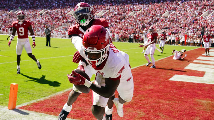 Arkansas Razorbacks running back Rashod Dubinion (7) pulls down a touchdown pass against the Alabama Crimson Tide during the second half at Bryant-Denny Stadium.