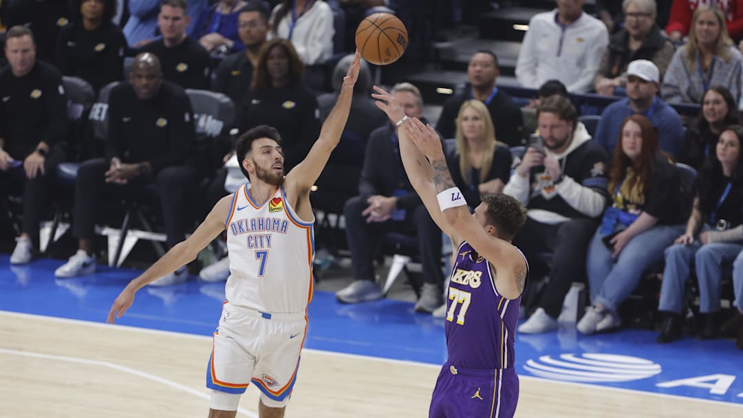 Nov 12, 2025; Oklahoma City, Oklahoma, USA; Oklahoma City Thunder center Chet Holmgren (7) defends a shot by Los Angeles Lakers guard Luka Doncic (77) during the first quarter at Paycom Center. Mandatory Credit: Alonzo Adams-Imagn Images