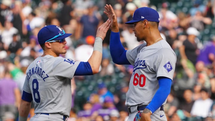 Sep 29, 2024; Denver, Colorado, USA; Los Angeles Dodgers first base Kike Hernandez (8) and relief pitcher Edgardo Henriquez (60) celebrate defeating the Colorado Rockies at Coors Field. Mandatory Credit: Ron Chenoy-Imagn Images Sep 29, 2024; Denver, Colorado, USA; Los Angeles Dodgers first base Kike Hernandez (8) and relief pitcher Edgardo Henriquez (60) celebrate defeating the Colorado Rockies at Coors Field. Mandatory Credit: Ron Chenoy-Imagn Images
