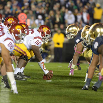 Oct 19, 2013; South Bend, IN, USA; General view of the line of scrimmage as Southern California Trojans center Marcus Martin (66) snaps the ball to quarterback Cody Kessler (6) against the Notre Dame Fighting Irish at Notre Dame Stadium. Notre Dame won 14-10. 
