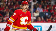 Mar 12, 2025; Calgary, Alberta, CAN; Calgary Flames center Connor Zary (47) skates against the Vancouver Canucks during the first period at Scotiabank Saddledome. Mandatory Credit: Sergei Belski-Imagn Images