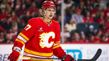 Mar 12, 2025; Calgary, Alberta, CAN; Calgary Flames center Connor Zary (47) skates against the Vancouver Canucks during the first period at Scotiabank Saddledome. Mandatory Credit: Sergei Belski-Imagn Images