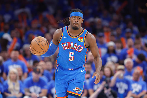 Oklahoma City Thunder guard Lu Dort dribbles down the court.