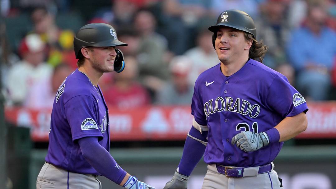 Colorado Rockies center fielder Jake McCarthy is congratulated by catcher Hunter Goodman 