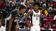 Jul 13, 2024; Las Vegas, NV, USA; San Antonio Spurs forward Donvan Williams (97) talks with Portland Trail Blazers guard Kendrick Davis (52) during the second quarter at Thomas & Mack Center.