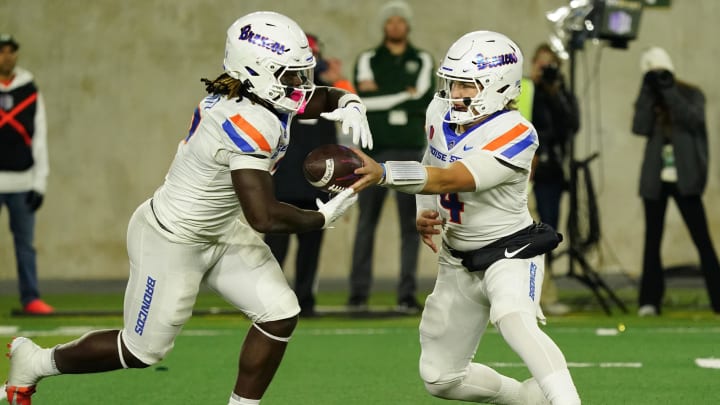 Oct 14, 2023; Fort Collins, Colorado, USA;  Boise State Broncos quarterback Maddux Madsen (4) hands off to Boise State Broncos running back Ashton Jeanty (2) in the first quarter against the Colorado State Rams at Sonny Lubick Field at Canvas Stadium. Mandatory Credit: Michael Madrid-USA TODAY Sports