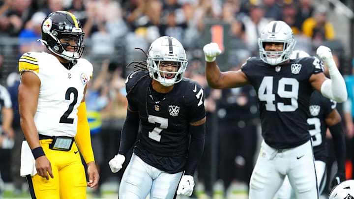 Las Vegas Raiders safety Tre'von Moehrig celebrates between Pittsburgh Steelers quarterback Justin Fields