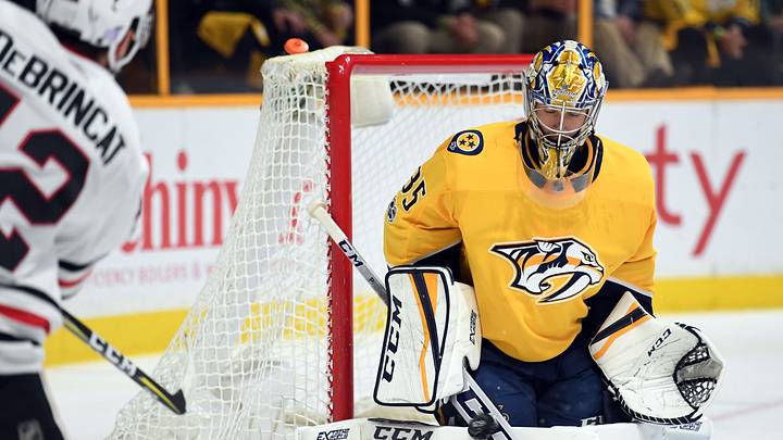 Nov 28, 2017; Nashville, TN, USA; Nashville Predators goalie Pekka Rinne (35) makes a save on a shot by Chicago Blackhawks right wing Alex DeBrincat (12) during the second period at Bridgestone Arena. Mandatory Credit: Christopher Hanewinckel-USA TODAY Sports Nov 28, 2017; Nashville, TN, USA; Nashville Predators goalie Pekka Rinne (35) makes a save on a shot by Chicago Blackhawks right wing Alex DeBrincat (12) during the second period at Bridgestone Arena. Mandatory Credit: Christopher Hanewinckel-USA TODAY Sports
