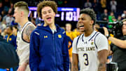 Mar 8, 2025; South Bend, Indiana, USA; Notre Dame Fighting Irish guard Braeden Shrewsberry (left) and guard Markus Burton (3) celebrate after Notre Dame defeated the Cal Bears 112-110 in four overtimes at the Purcell Pavilion. 