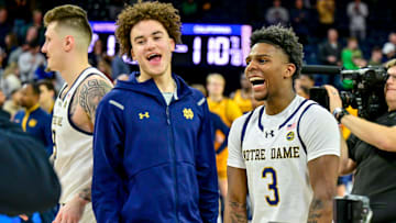 Mar 8, 2025; South Bend, Indiana, USA; Notre Dame Fighting Irish guard Braeden Shrewsberry (left) and guard Markus Burton (3) celebrate after Notre Dame defeated the Cal Bears 112-110 in four overtimes at the Purcell Pavilion. 