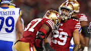 Dec 12, 2024; Santa Clara, California, USA; San Francisco 49ers linebacker Dre Greenlaw (57) is congratulated by safety Talanoa Hufanga (29) after making a tackle against the Los Angeles Rams in the first quarter at Levi's Stadium. Mandatory Credit: Cary Edmondson-Imagn Images