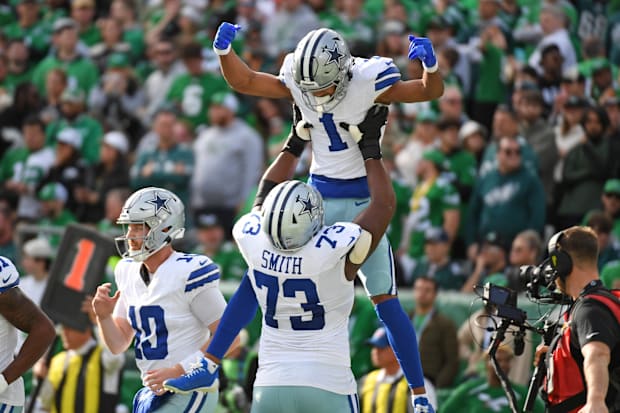 Dallas Cowboys wide receiver Jalen Tolbert celebrates his touchdown catch with Tyler Smith against the Philadelphia Eagles.
