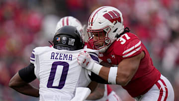 Wisconsin tight end Riley Nowakowski (37) blocks Northwestern defensive back Coco Azema (0) during the first quarter of their game Saturday, November 11, 2023 at Camp Randall Stadium in Madison, Wisconsin.