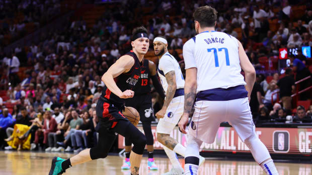 Apr 10, 2024; Miami, Florida, USA; Miami Heat guard Tyler Herro (14) drives to the basket as Dallas