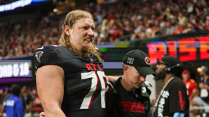 Sep 22, 2024; Atlanta, Georgia, USA; Atlanta Falcons offensive tackle Kaleb McGary (76) leaves the field with an injury against the Kansas City Chiefs in the second quarter at Mercedes-Benz Stadium. Mandatory Credit: Brett Davis-Imagn Images
