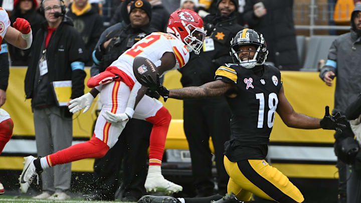 Dec 25, 2024; Pittsburgh, Pennsylvania, USA; Pittsburgh Steelers wide receiver Mike Williams (18) reaches for a pass that fell incomplete in front of Kansas City Chiefs cornerback Joshua Williams (2) )during the second quarter at Acrisure Stadium. Mandatory Credit: Barry Reeger-Imagn Images