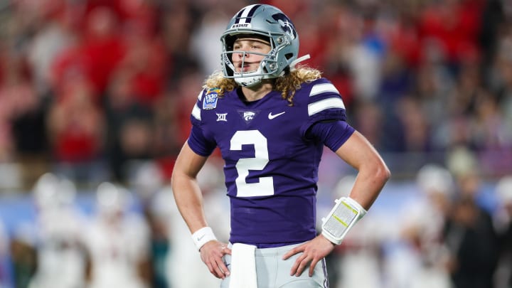 Dec 28, 2023; Orlando, FL, USA;  Kansas State Wildcats quarterback Avery Johnson (2) waits for a play call against the North Carolina State Wolfpack in the first quarter during the Pop-Tarts bowl at Camping World Stadium