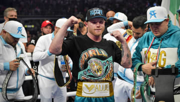 Canelo Alvarez celebrates defeating Billy Joe Saunders during a super middleweight boxing title fight at AT&T Stadium. 
