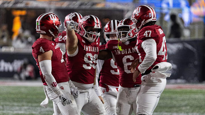 Indiana Hoosiers defensive lineman James Carpenter (99) celebrates his run for a first down with teammates in the second half against the Purdue Boilermakers at Memorial Stadium. Indiana Hoosiers defensive lineman James Carpenter (99) celebrates his run for a first down with teammates in the second half against the Purdue Boilermakers at Memorial Stadium.