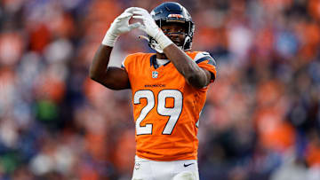Dec 15, 2024; Denver, Colorado, USA; Denver Broncos cornerback Ja'Quan McMillian (29) gestures in the third quarter against the Indianapolis Colts at Empower Field at Mile High. 