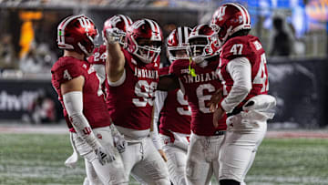 Nov 30, 2024; Bloomington, Indiana, USA; Indiana Hoosiers defensive lineman James Carpenter (99) celebrates his run for a first down with teammates  in the second half against the Purdue Boilermakers at Memorial Stadium. Mandatory Credit: Trevor Ruszkowski-Imagn Images