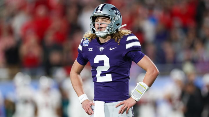 Dec 28, 2023; Orlando, FL, USA;  Kansas State Wildcats quarterback Avery Johnson (2) waits for a play call against the North Carolina State Wolfpack in the first quarter during the Pop-Tarts bowl at Camping World Stadium. Mandatory Credit: Nathan Ray Seebeck-USA TODAY Sports