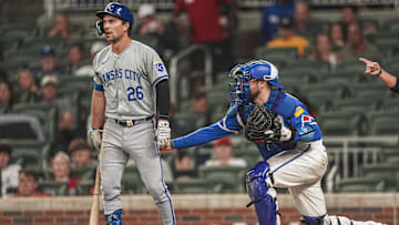 Sep 28, 2024; Cumberland, Georgia, USA; Atlanta Braves catcher Travis d'Arnaud (16) tags out Kansas City Royals second baseman Adam Frazier (26) after a dropped third strike during the sixth inning at Truist Park. Mandatory Credit: Dale Zanine-Imagn Images